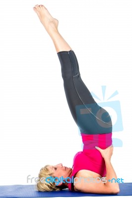 Middle Age Woman Doing Yoga Exercises Stock Photo