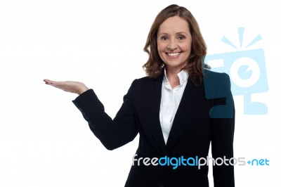 Middle Aged Corporate Woman Showing Copy Space Stock Photo