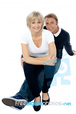 Middle Aged Lady Sitting On Her Man's Lap Stock Photo