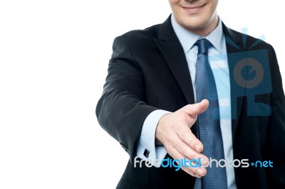 Middle Aged Man Stretching Out His Hand For Shaking Stock Photo