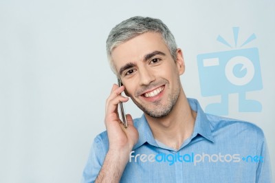 Middle Aged Man Talking On Cell Phone Stock Photo