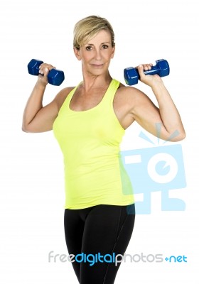 Middle Aged Woman Doing Exercise Stock Photo