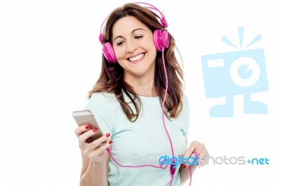 Middle Aged Woman Enjoying Listening Music Stock Photo