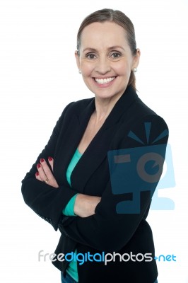 Middle Aged Woman Posing Against White Background Stock Photo