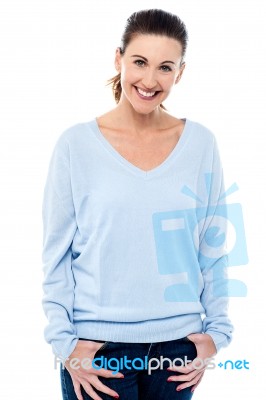 Middle Aged Woman With Hands In Pocket Stock Photo