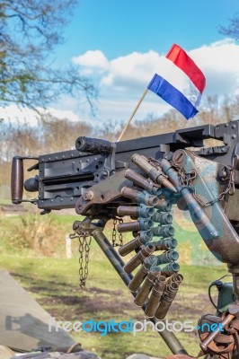 Military Machine Gun With Bullets And Dutch Flag Stock Photo