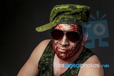 Military Style Camouflage On The Soldier's Face Stock Photo