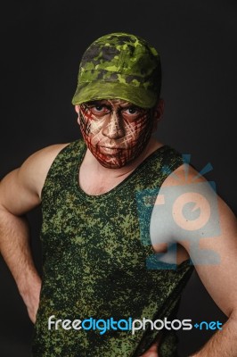 Military Style Camouflage On The Soldier's Face Stock Photo