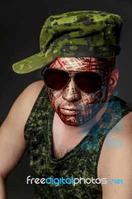 Military Style Camouflage On The Soldier's Face Stock Photo