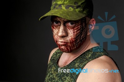 Military Style Camouflage On The Soldier's Face Stock Photo