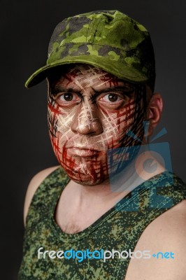 Military Style Camouflage On The Soldier's Face Stock Photo