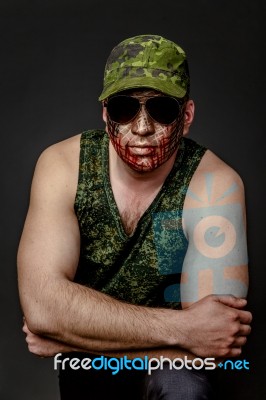 Military Style Camouflage On The Soldier's Face Stock Photo