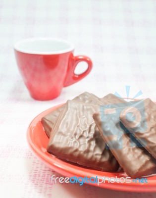 Milk Chocolate Pieces And Coffee Cup Stock Photo