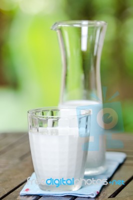 Milk Jug With Milk Glass Stock Photo