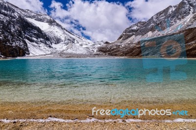 Milk Lake In The Snow Mountains At Yading Nature Reserve Stock Photo