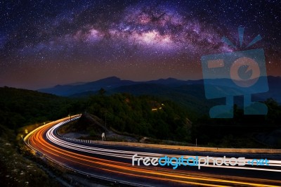 Milky Way And Car Light On Road At Doi Inthanon National Park In The Night, Chiang Mai, Thailand Stock Photo