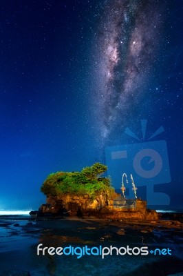 Milky Way Over Tanah Lot Temple At Night In Bali, Indonesia.(dark) Stock Photo