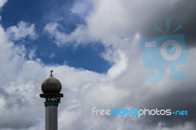 Minaret With Clouds In The Background Stock Photo