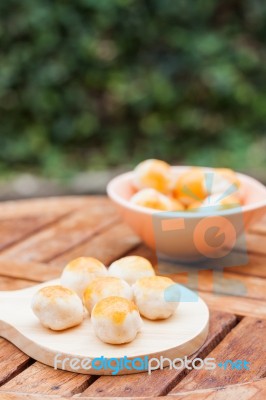 Mini Chinese Cakes On Wooden Plate Stock Photo