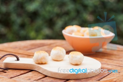 Mini Chinese Cakes On Wooden Plate Stock Photo