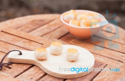 Mini Chinese Cakes On Wooden Plate Stock Photo