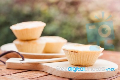 Mini Pies On Wooden Plate Stock Photo