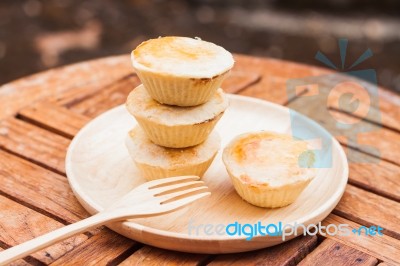 Mini Pies On Wooden Plate Stock Photo