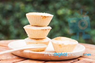 Mini Pies On Wooden Plate Stock Photo