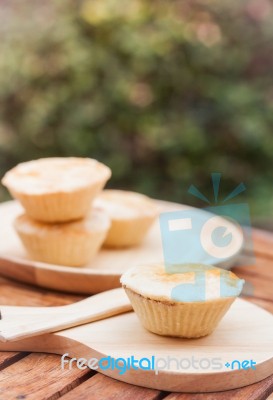 Mini Pies On Wooden Plate Stock Photo