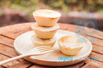 Mini Pies On Wooden Plate Stock Photo