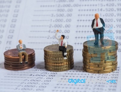 Miniature Businessman Stand On Book Bank, Near Pile Of Coins. Bu… Stock Photo