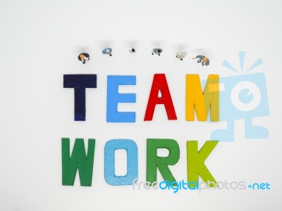 Miniature Bussinessman With Teamwork Word Letters On White Backg… Stock Photo