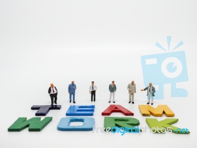 Miniature Bussinessman With Teamwork Word Letters On White Backg… Stock Photo