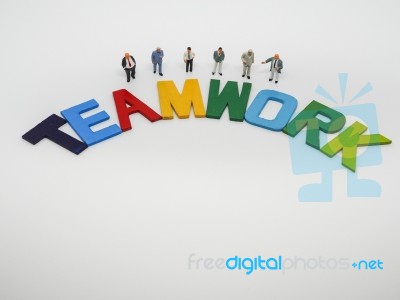 Miniature Bussinessman With Teamwork Word Letters On White Backg… Stock Photo