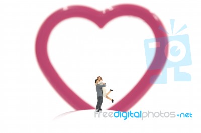 Miniature Couple Hugging And Red Heart On White Background, Stock Photo