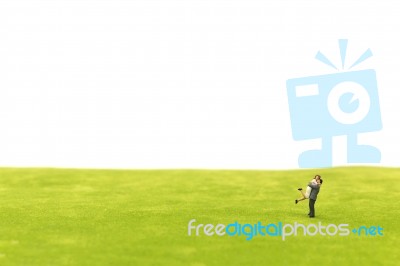 Miniature Couple Hugging On Green Fields Stock Photo