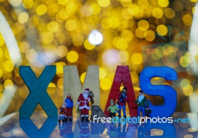 Miniature Santa Claus And Family With Beautiful Light Bokeh Back… Stock Photo