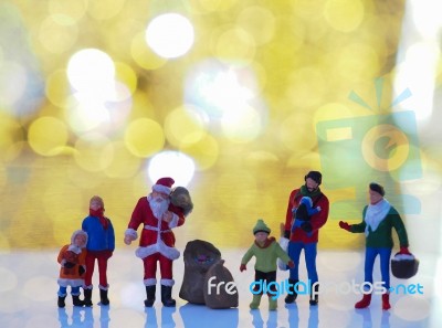 Miniature Santa Claus And Family With Beautiful Light Bokeh Back… Stock Photo