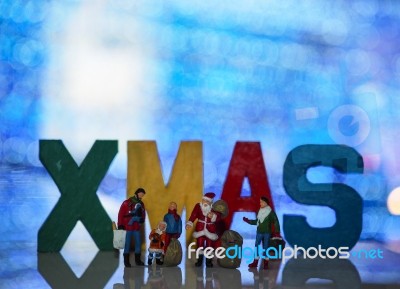 Miniature Santa Claus And Family With Beautiful Light Bokeh Back… Stock Photo