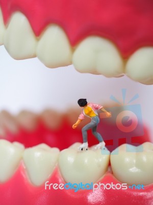 Miniature Teenager Girl Skating On Plastic Teeth Of Removable De… Stock Photo