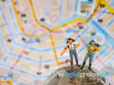 Miniature Traveller Or Backpacker Stand On Globe Of Glass And Ma… Stock Photo