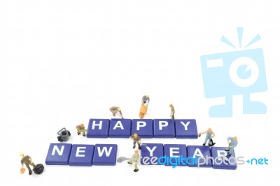 Miniature Worker Team Building Word Happy New Year Stock Photo