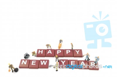 Miniature Worker Team Building Word Happy New Year Stock Photo