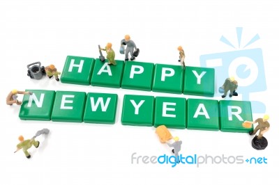 Miniature Worker Team Building Word Happy New Year On White Back… Stock Photo