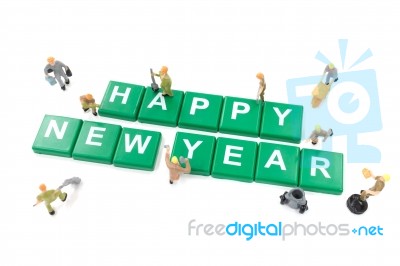 Miniature Worker Team Building Word Happy New Year On White Back… Stock Photo