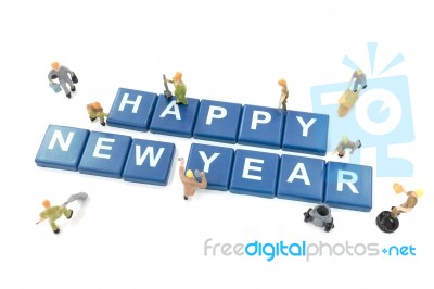 Miniature Worker Team Building Word Happy New Year On White Back… Stock Photo