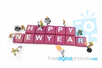 Miniature Worker Team Building Word Happy New Year On White Back… Stock Photo