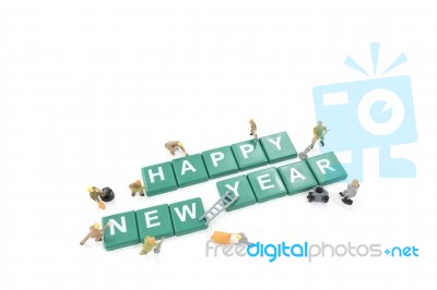 Miniature Worker Team Building Word Happy New Year On White Back… Stock Photo