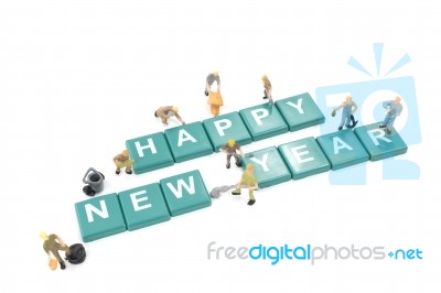 Miniature Worker Team Building Word Happy New Year On White Back… Stock Photo