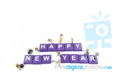 Miniature Worker Team Building Word Happy New Year On White Back… Stock Photo